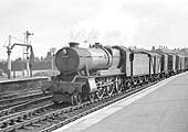 Ex-GWR 4-6-0 County class No 1028 'County of Warwick' passes through Leamington near the town of its name, on a down freight