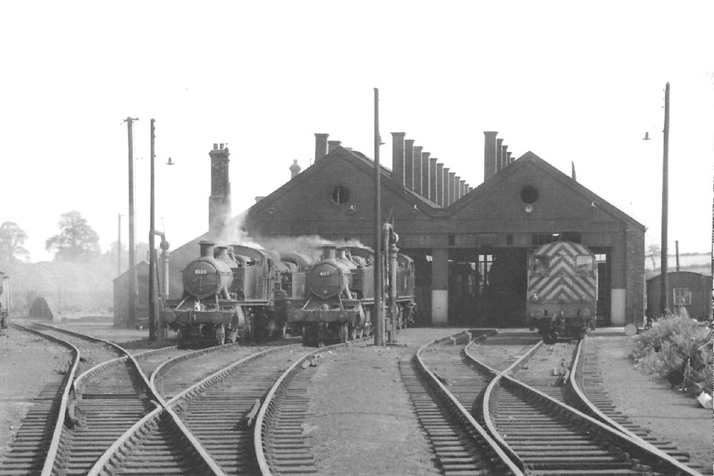 A solitary 0-6-0 Diesel shunter stands on the right hand road alongside a number of ex-GWR locomotives on 27th April 1961