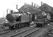 Ex-GWR 56xx Class 0-6-2T No 6671 and British Railways 4MT 2-6-4T No 80072 stand outside the shed on 13th Match 1965