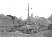 Ex-GWR 61xx Class 2-6-2T No 6169 stands outside Leamington shed with other ex-GWR locomotives