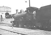 Former Cambrian 4-4-0 No 1100 stands next to the water hydrant awaiting its turn to be coaled circa 1929