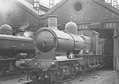 GWR 4-4-0 No 3218 is seen prepared for its next trip whilst on the left is an unknown 0-6-0PT locomotive
