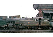 Ex-LMS 2-6-4T No 42566, is standing in front of Leamington shed's coaling stage in March 1962
