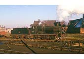 Ex-GWR 0-6-0 No 2201 is shunting wagons on the coal stage roads at Leamington shed in December 1961