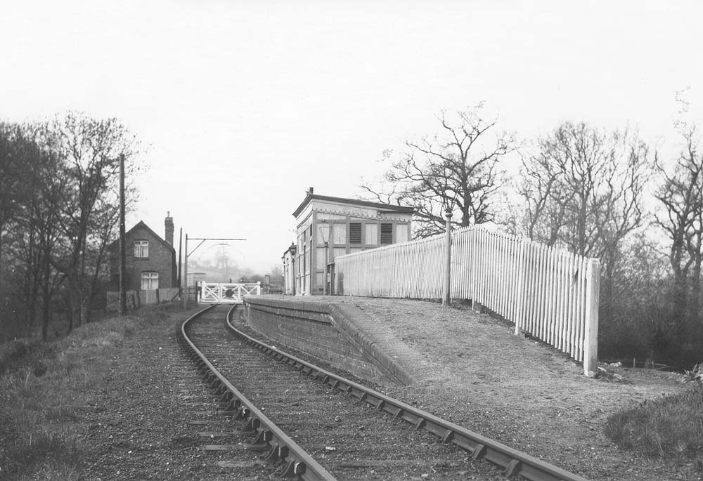 Looking towards the goods yard with the branch to Moreton-in-Marsh curving to the left beyond the level crossing gates