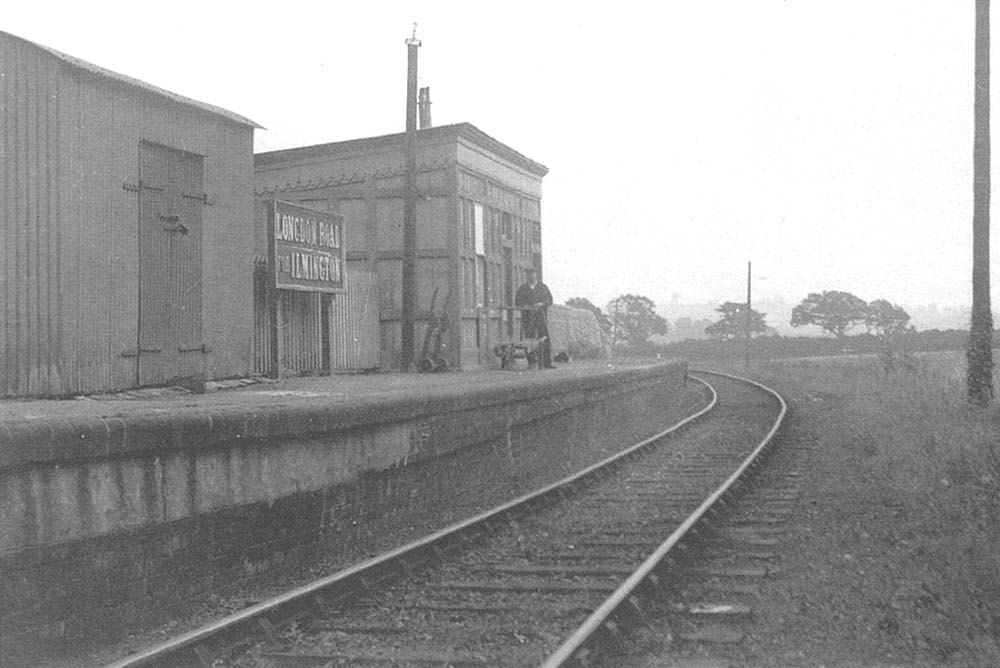View looking in the direction of Shipston-on-Stour showing the station name board 'Longdon Road for Ilmington' and the corrugated hut used to store parcels
