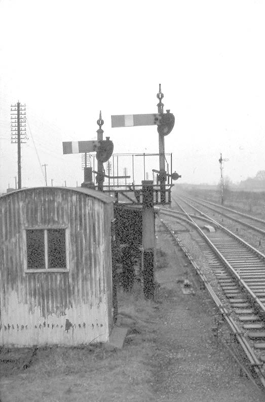 View of the signal bracket displaying Long Marston's down starting signal and siding signal