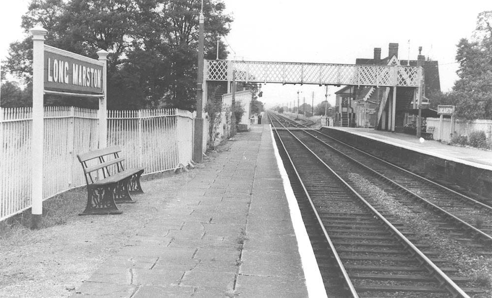 Another 1950s view looking towards Stratford upon Avon showing the crossing closed to road traffic and widened platform on the left