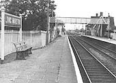 Another 1950s view looking towards Stratford upon Avon showing the crossing closed to road traffic and widened platform on the left