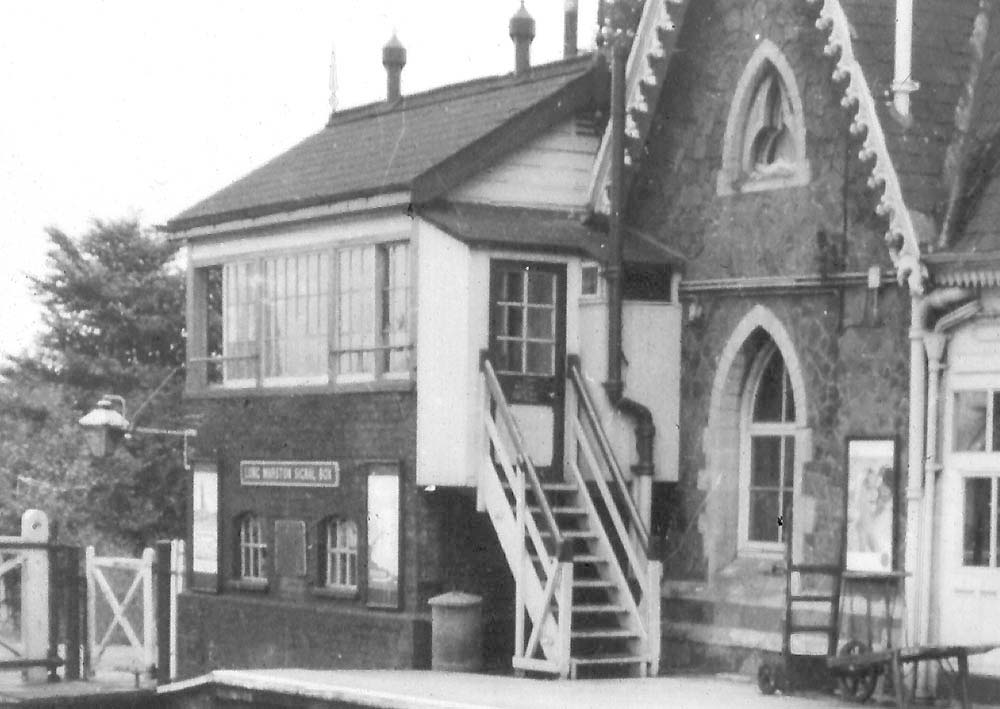 Close up showing the most obvious visual change to the station, the steps of the signal box being moved nearer to the line