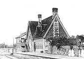 View showing Long Marston station's signal box accessed from the platform and the facade to the booking office and waiting room