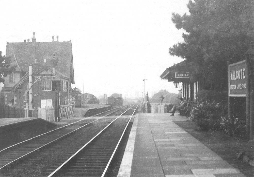 Looking towards Honeybourne showing passengers waiting for an up service to Stratford on Avon