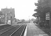 Looking south towards Honeybourne showing passengers seated whilst waiting for an up service to Stratford on Avon