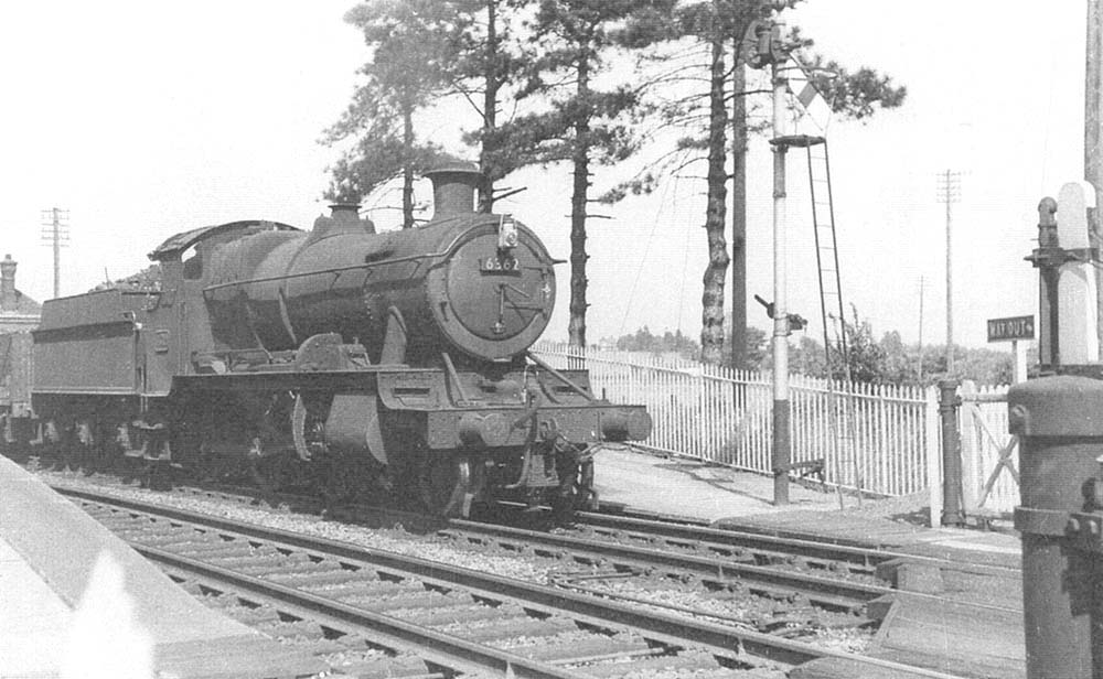 Ex-GWR 2-6-0 43xx Class No 6362 is seen at the head of a down freight service to Honeybourne