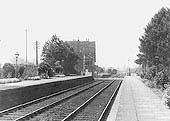 Looking towards Honeybourne along the up platform with the goods yard in the distance on the left beyond the 1859 station