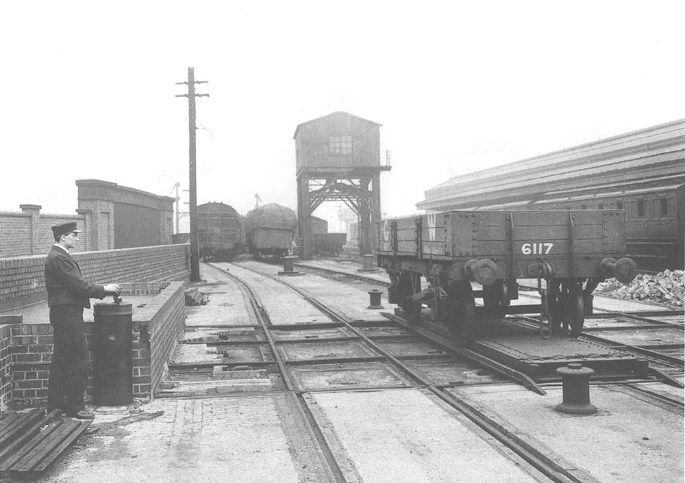 View of a demonstration showing how wagons are moved on a traverser whilst in the background the second wagon hoist to lower shed 'B' can be seen
