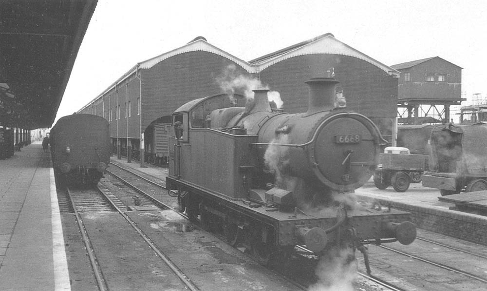 Ex-GWR 0-6-2T 56xx class No 6668 is seen about to depart the traverser having brought the 6 25 pm local passenger service from Knowle & Dorridge