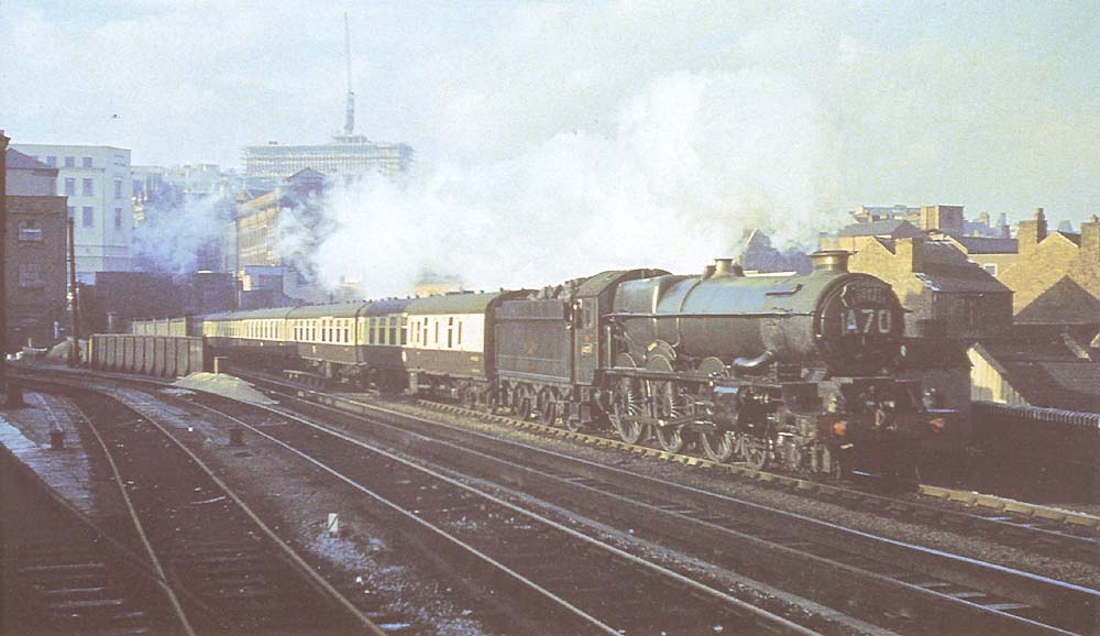 Ex-GWR 4-6-0 King class No 6026 'King John' is seen at the head of the up Cambrian Express as it leaves Snow Hill tunnel by Moor Street station in 1959