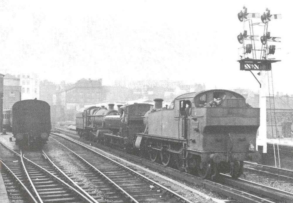 Three Great Western Railway designed locomotives running light past Moor Street Station on the down main line to Snow Hill