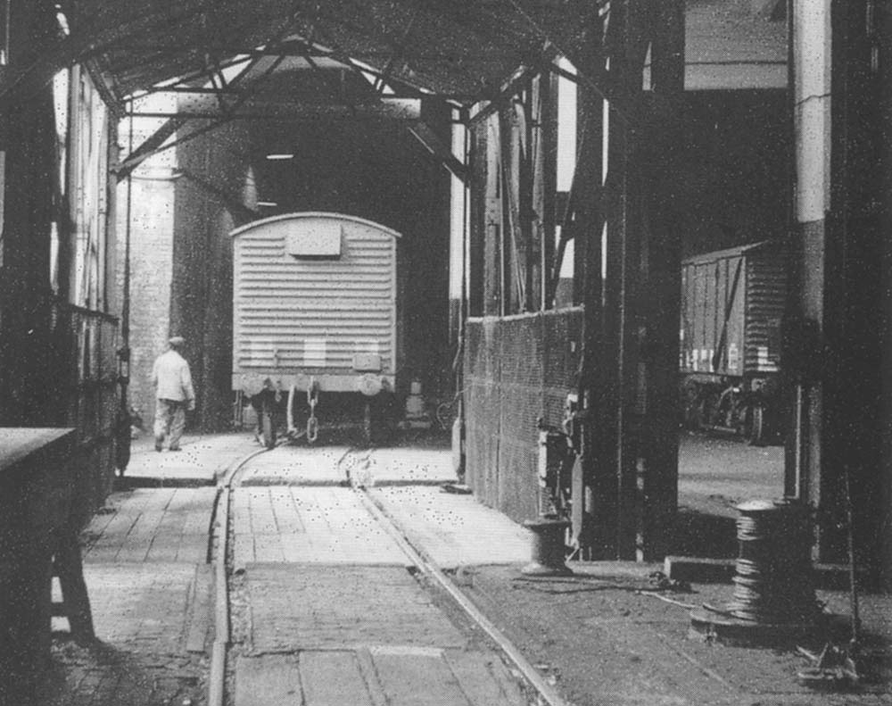Shunter A Facey guides the van off the hoist in lower level shed 'B' and on to the traverser