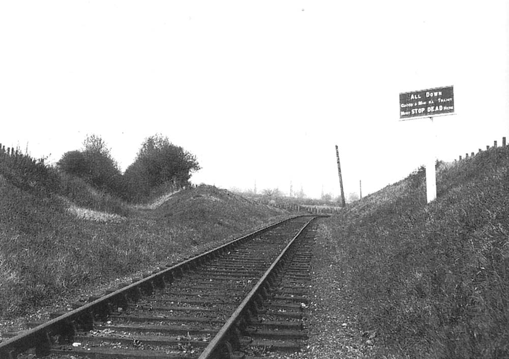 View of the Stop Board sited just south of Longdon Road station with the line of the original tramway to be seen on the left