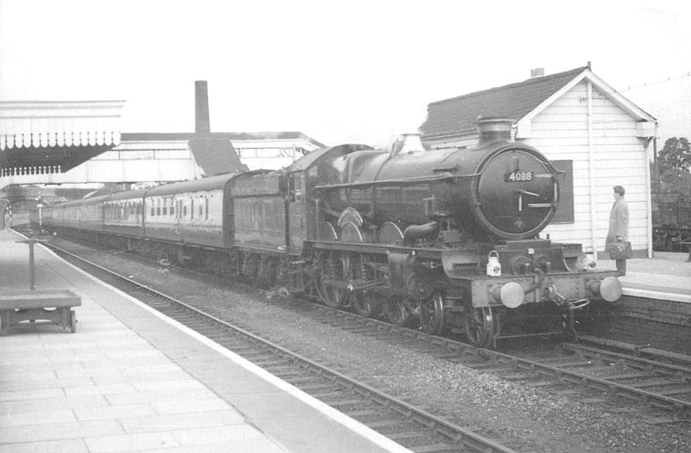 View of GWR 4-6-0 No 4088 'Dartmouth Castle' passing through the station on an up Worcester to Paddington express
