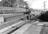 British Railways 4-6-0 40xx �Castle� class No 7008 �Swansea Castle� steams away from the Down Relief platform at Olton station