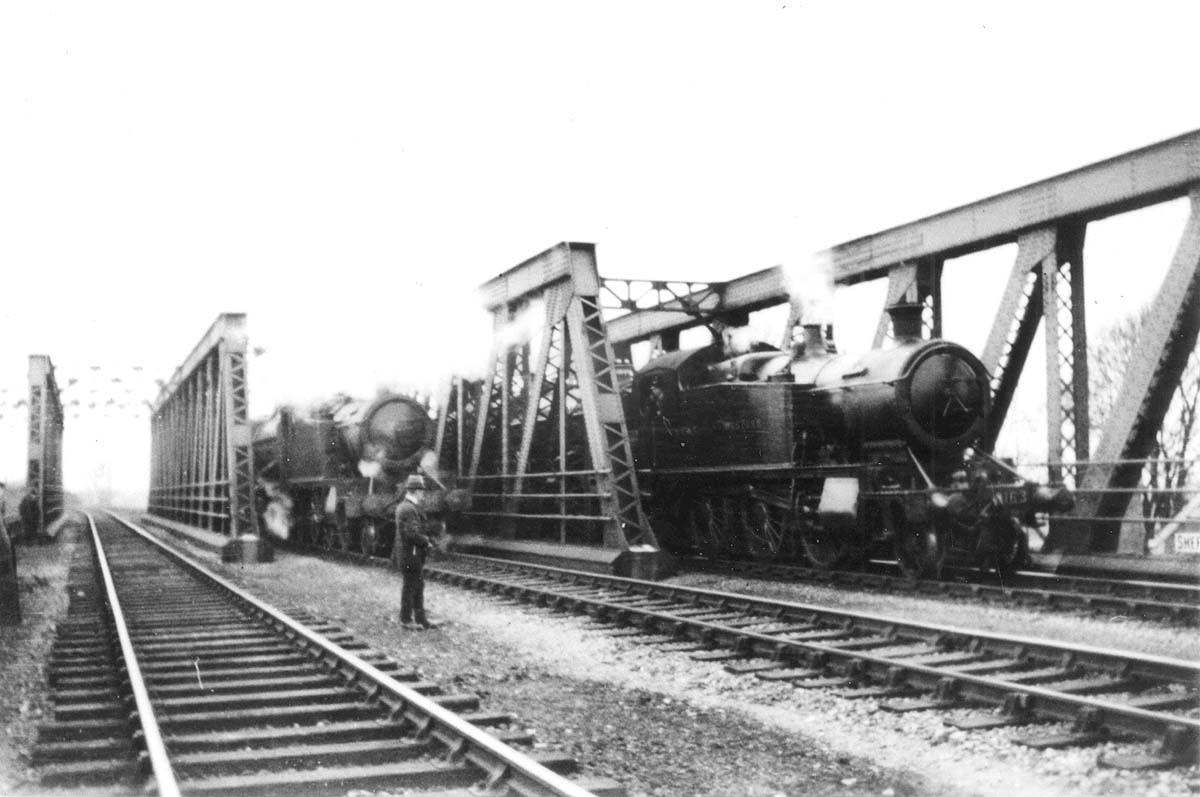 The photographer is looking towards Solihull with Olton station in the distance with the locomotives are standing on new lattice girder bridge