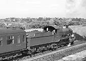 Ex-GWR 43xx Class 2-6-0 No 6364 passes through Queens Head sidings with an up express service on 29th June 1964