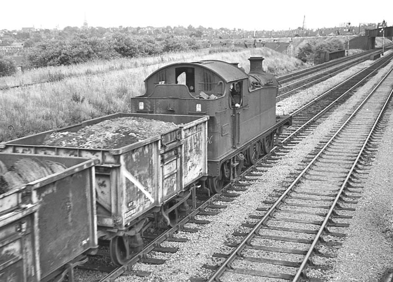 Ex-GWR 56xx Class 0-6-2T No 5606 passes through Queens Head sidings with an up freight service on 16th July 1964