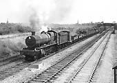 Ex-GWR 49xx Class 4-6-0 No 6955 'Lydcott Hall' passes under the former LMS line with a down freight on 20th July 1964