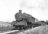 Ex-GWR 68xx Class 4-6-0 No 6830 'Buckenhill Grange' passes through Queens Head sidings with a down express on 3rd July 1964