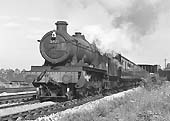 Ex-GWR 49xx Class 4-6-0 No 5971 'Merevale Hall' passes under the former LMS line with a down express on 29th June 1964