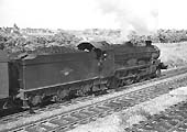Ex-GWR Castle Class 4-6-0 No 5091 'Cleeve Abbey' is seen passing Queens Head sigings on 29th June 1964