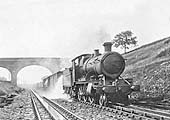 Great Western Railway 2-6-0 43xx class mogul No.4320, with a class H ‘through freight’ train, drenches the first wagon and the permanent way