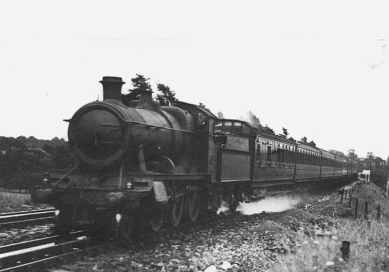 GWR 2-6-0 No No 6385 heads a train of ex-SERC coaching stock on a down service starting from the Kent coast circa 1933