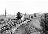 An unidentified King Class locomotive passes Rowington Junction with a down express on 3rd March 1961