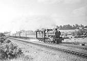 An unidentified ex-GWR 4-6-0 Hall Class locomotive is seen on a Class B working when picking up water