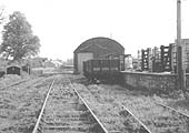 View of the station and goods yard with the track over grown taken one year after being brought into British Railways ownership