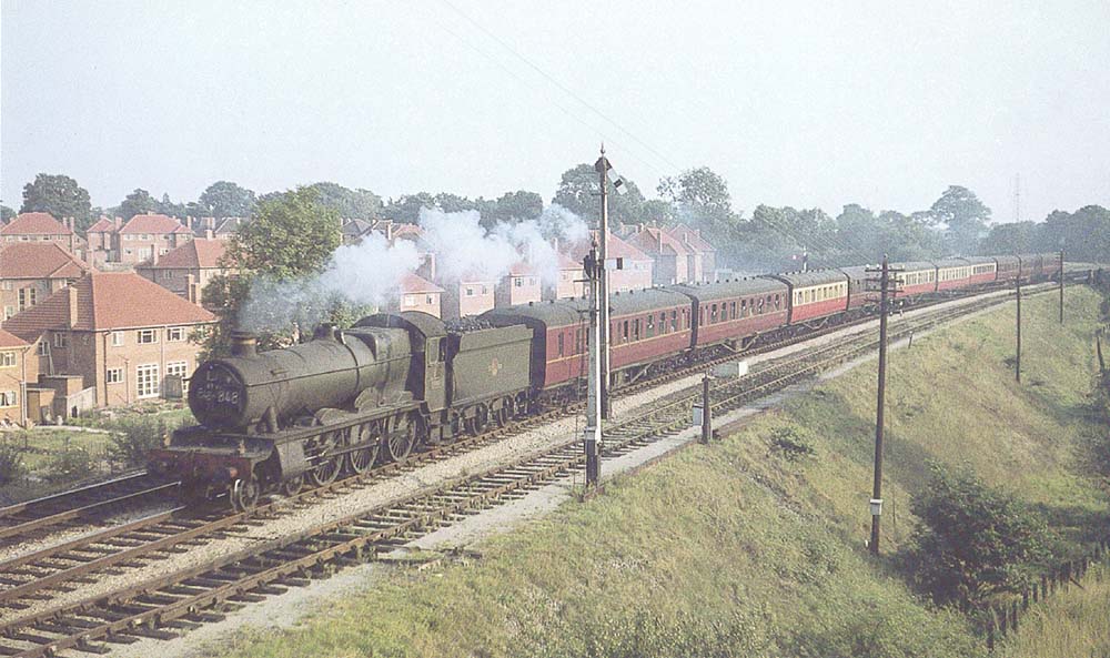 Ex-GWR 4-6-0 No 4991 Cobham Hall approaches Hasluck's Green Road bridge on 29th August 1959
