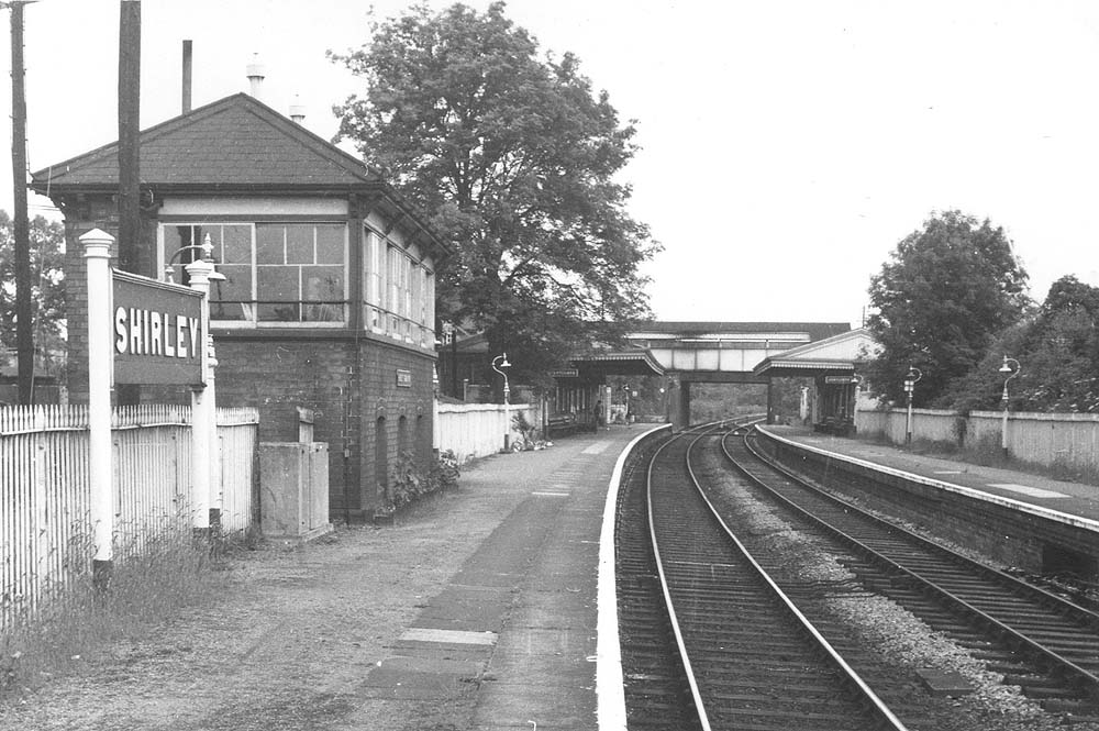 Looking towards Stratford upon Avon from the goods yard end of the down platform with Shirley's signal box straddling the platform and sidings on the left