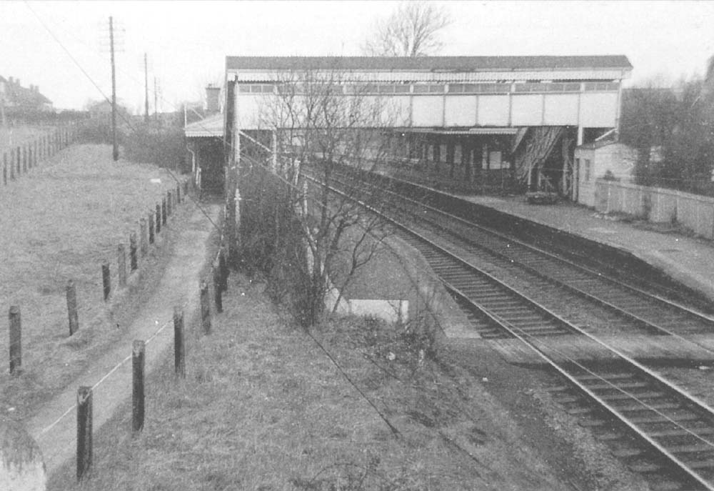 Looking towards Birmingham from Haslucks Green Road bridge with the up platform and passenger building beyond the footbridge on the left