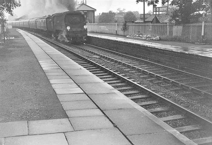 British Railways built to a SR design 4-6-2 West Country class No 34105 'Swanage' passes through Shirley on an empty stock working