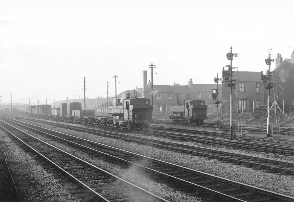 View Small Heath's down sidings looking North of whilst a pair of unidentified ex-GWR 0-6-0PT 57xx class locomotives rest in between shunting the yard