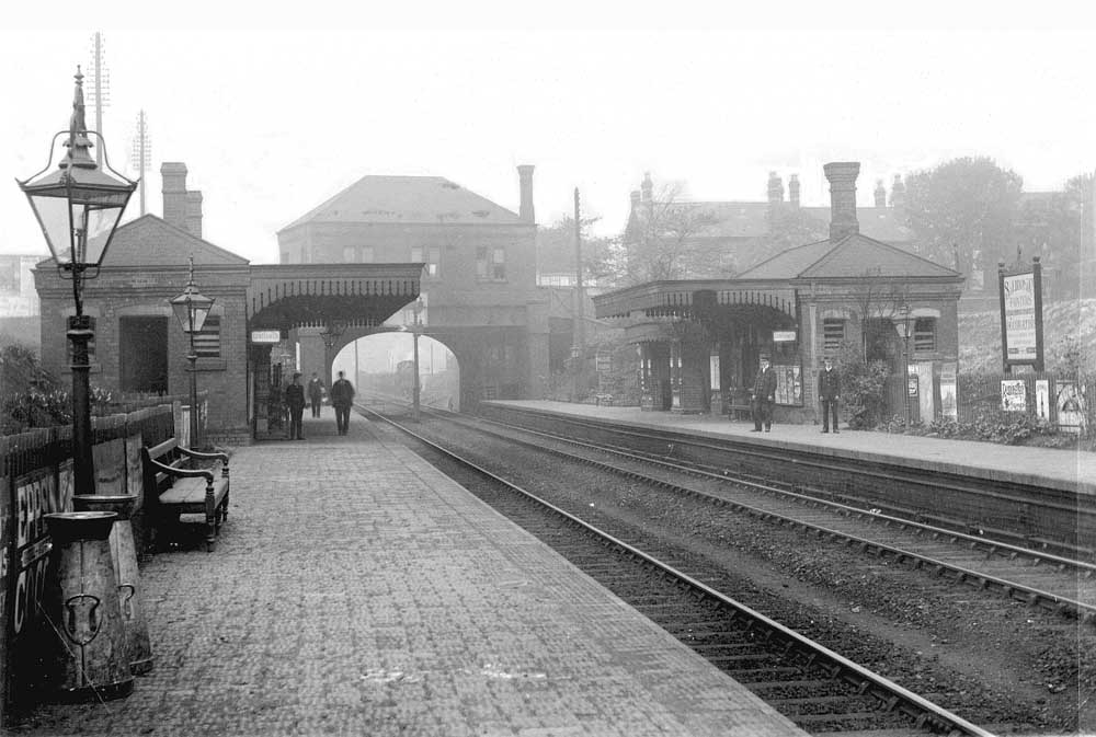 General view of the original 1863 station looking in the direction of Snow Hill showing the booking office erected on Golden Hillock Road over bridge