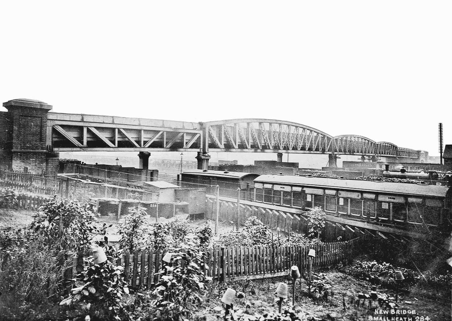An Edwardian view of Small Heath Bridge which opened in 1904 to span both the railway and the Warwick & Birmingham Canal