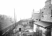 Looking in the direction of Birmingham with the main and relief lines to be seen on the left and a wartime 'Anderson' shelter in the garden