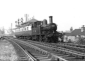 Ex-GWR 0-4-2T No 1458 in black livery coupled to an auto-trailer leaving Soho and Winson Green Station