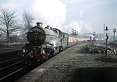 Ex-Great Western 4-6-0 King class No 6012 'King Edward VI' is seen steaming past Soho & Winson Green Station