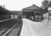 Looking towards Wolverhampton along the Up Main platform as a class C train approaches, circa 1960